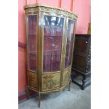A French Louis XV style beech and gilt metal mounted Vernis Martin vitrine, with painted panels