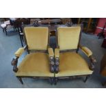 A pair of 19th Century Italian Baroque revival carved walnut and upholstered open armchairs