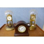 Two brass torsion anniversary clocks and a Japy Freres timepiece
