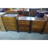 A pair of oak chests of drawers and another oak chest of drawers