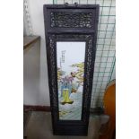 A Chinese hand painted porcelain plaque in carved frame