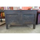 A William III carved oak panelled coffer