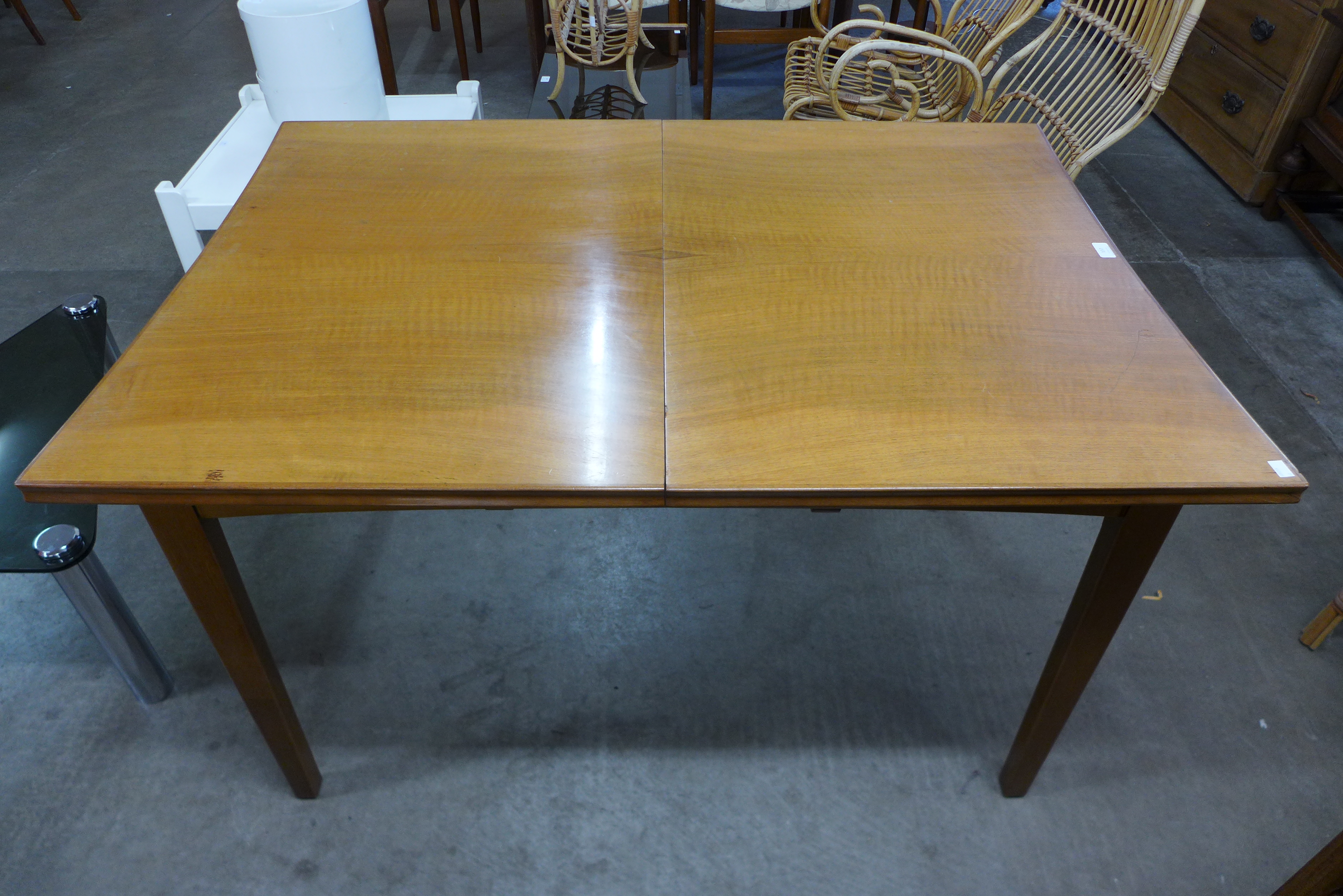 A walnut extending dining table