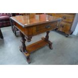 A Victorian walnut single drawer side table
