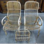 A pair of wicker armchairs and a magazine rack