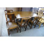 An oak refectory table and four chairs