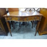 An inlaid mahogany serpentine two drawer side table