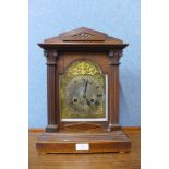 A 19th Century German oak mantel clock