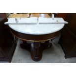 A Victorian mahogany and marble topped demi lune washstand