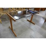 A Danish teak and glass topped coffee table