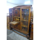 An oak secretaire bookcase