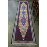 A Persian hand knotted kilim runner rug