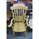 A pair of beech farmhouse armchairs