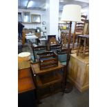 A carved oak trolley, letter rack and a standard lamp