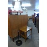 A teak standard lamp and a trolley