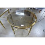An Italian brass and glass topped circular occasional table