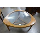 A Nathan teak and glass topped triangular coffee table