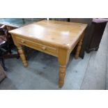 A pine single drawer kitchen table