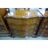 A George III style burr walnut serpentine chest of drawers