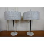 A pair of painted steel table lamps