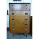 A teak chest of drawers