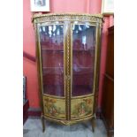 A French Louis XV style beech and gilt metal mounted Vernis Martin vitrine, with painted panels
