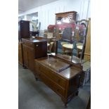An oak dressing table and matching tallboy