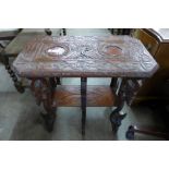 An eastern carved wood occasional table