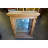 A pine wall mounted display cabinet