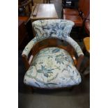 A Victorian beech and upholstered tub chair