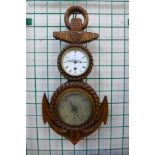 A Victorian carved oak anchor shaped aneroid barometer and clock