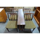 A teak drop-leaf table and four chairs