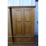 A pine two door wardrobe