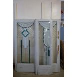 An Art Deco stained glass door and pair of matching side panels