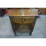 A 17th Century style carved credence cupboard