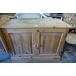 A pine two door cupboard