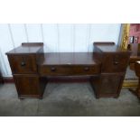 A Regency inlaid mahogany breakfront serving table