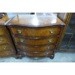 A George III style burr walnut serpentine chest of drawers
