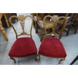 A pair of Victorian inlaid mahogany nursing chairs