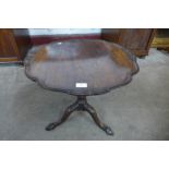 A Chippendale Revival carved mahogany tripod wine table