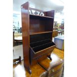 A small mahogany open bookcase/newspaper stand