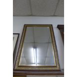 A mahogany and parcel gilt framed mirror