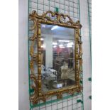 A gilt framed mirror