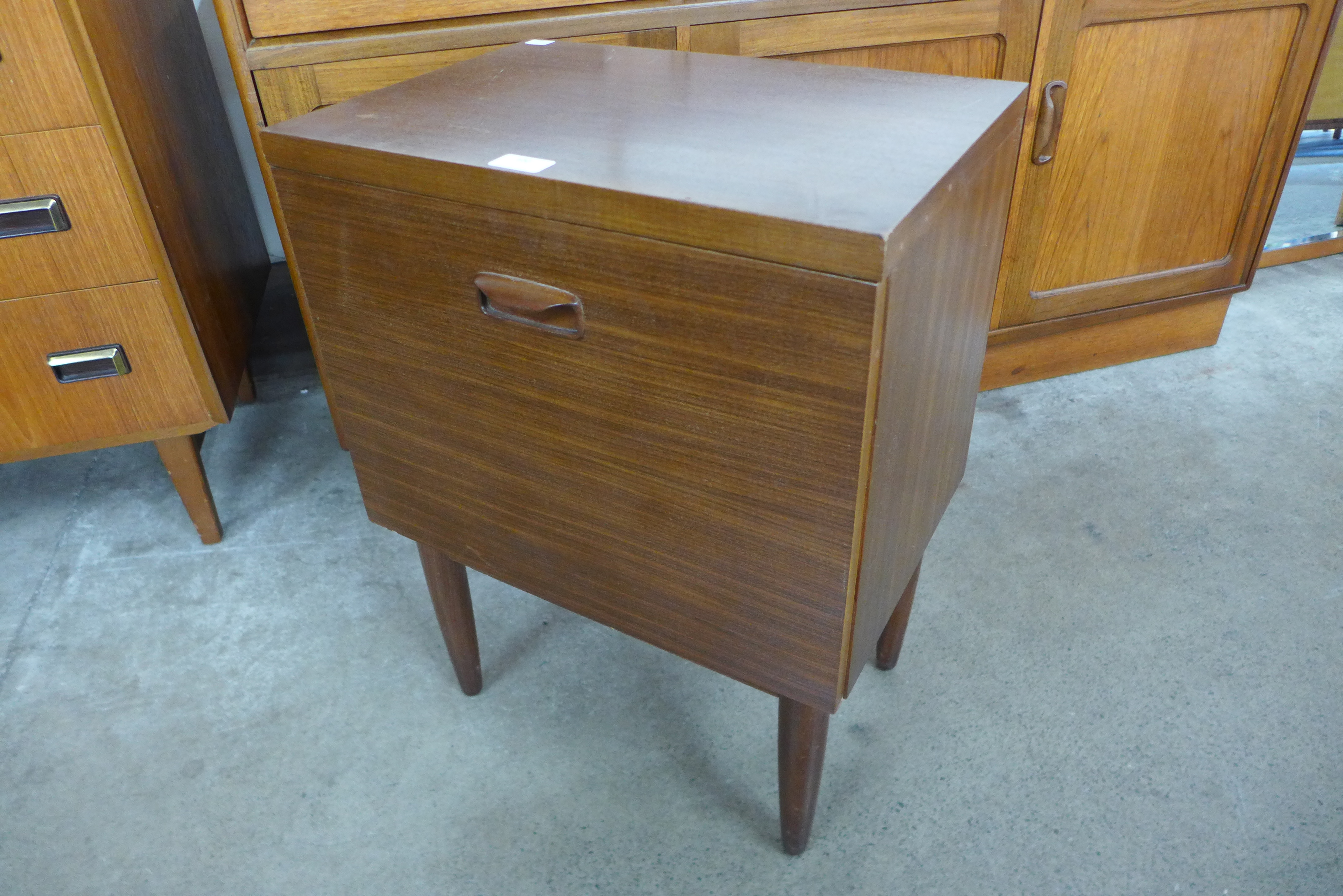 A teak bedside cabinet