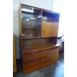 A teak display cabinet