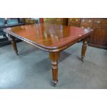 A Victorian mahogany extending dining table