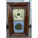 A Victorian walnut 8-day spring driven ogee walnut clock