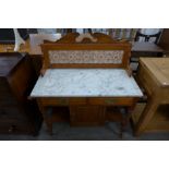 A Victorian satin birch and marble topped washstand