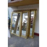 A pair of gilt framed mirrors and one other