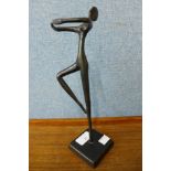 A surrealist bronze figure of a dancing woman